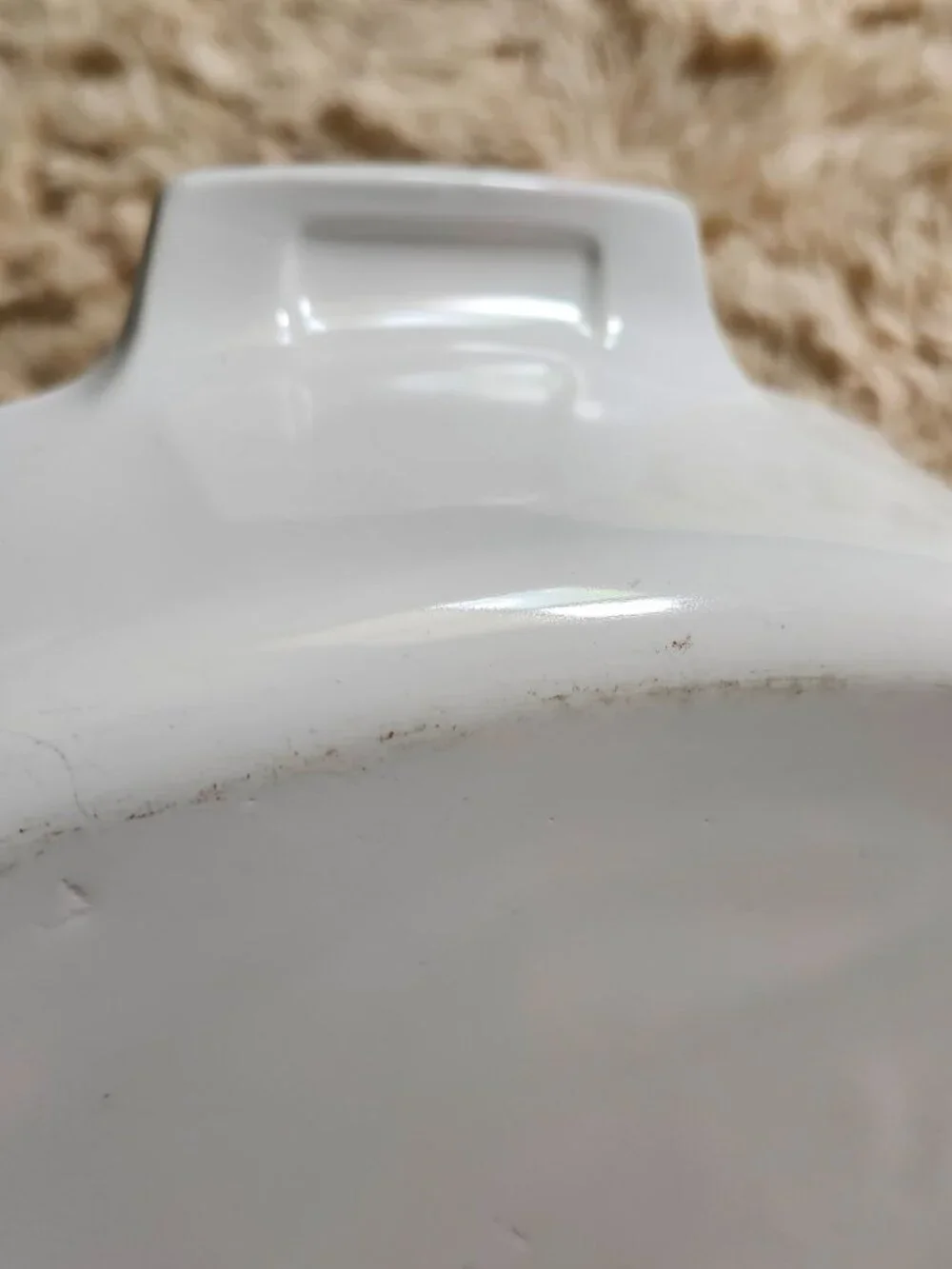 Three CorningWare casserole dishes with lids